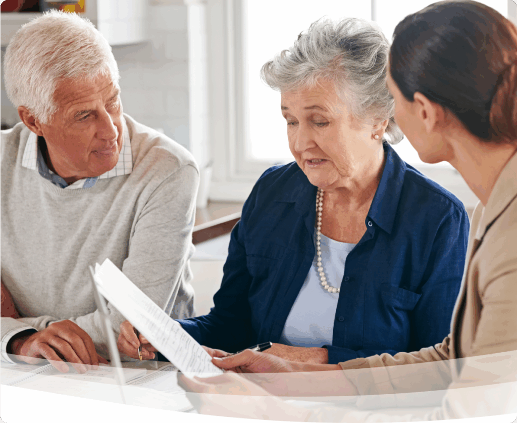 a group of people looking at a piece of paper
