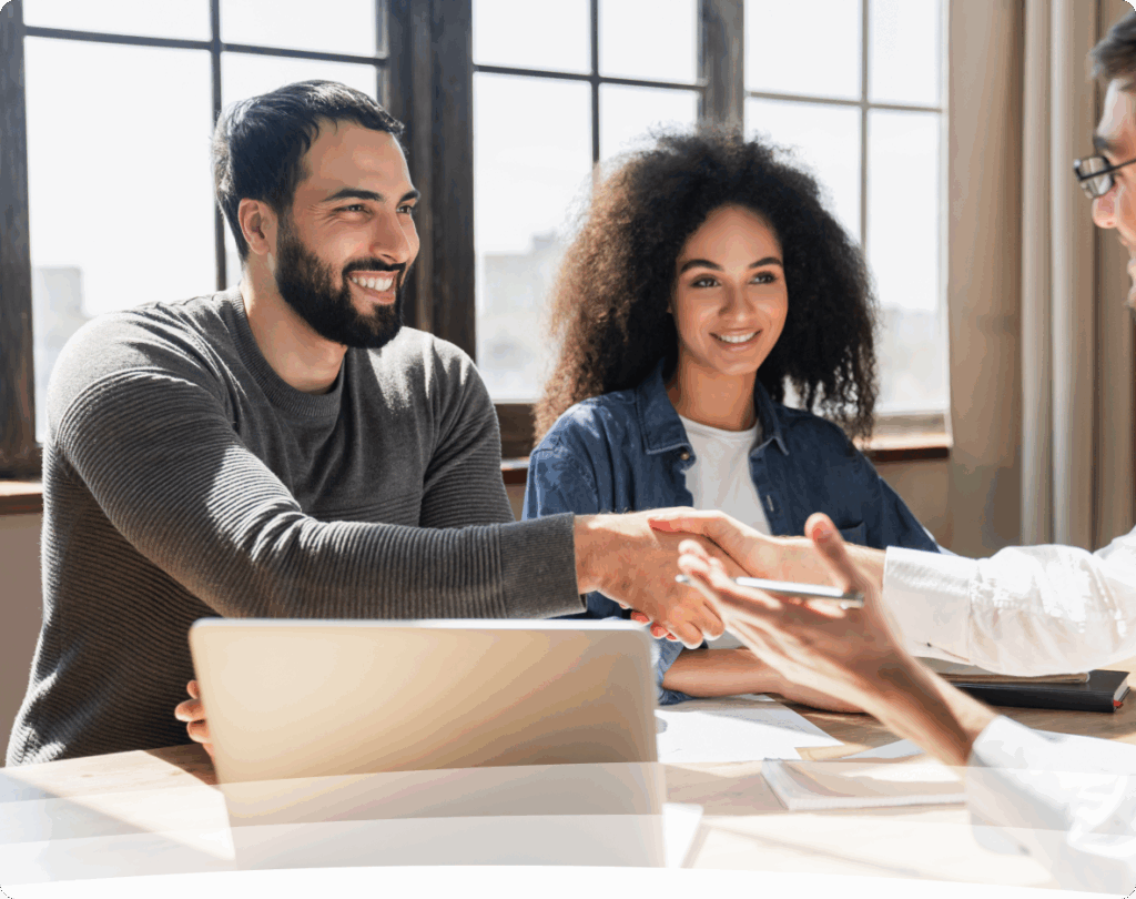 a man shaking hands with a woman